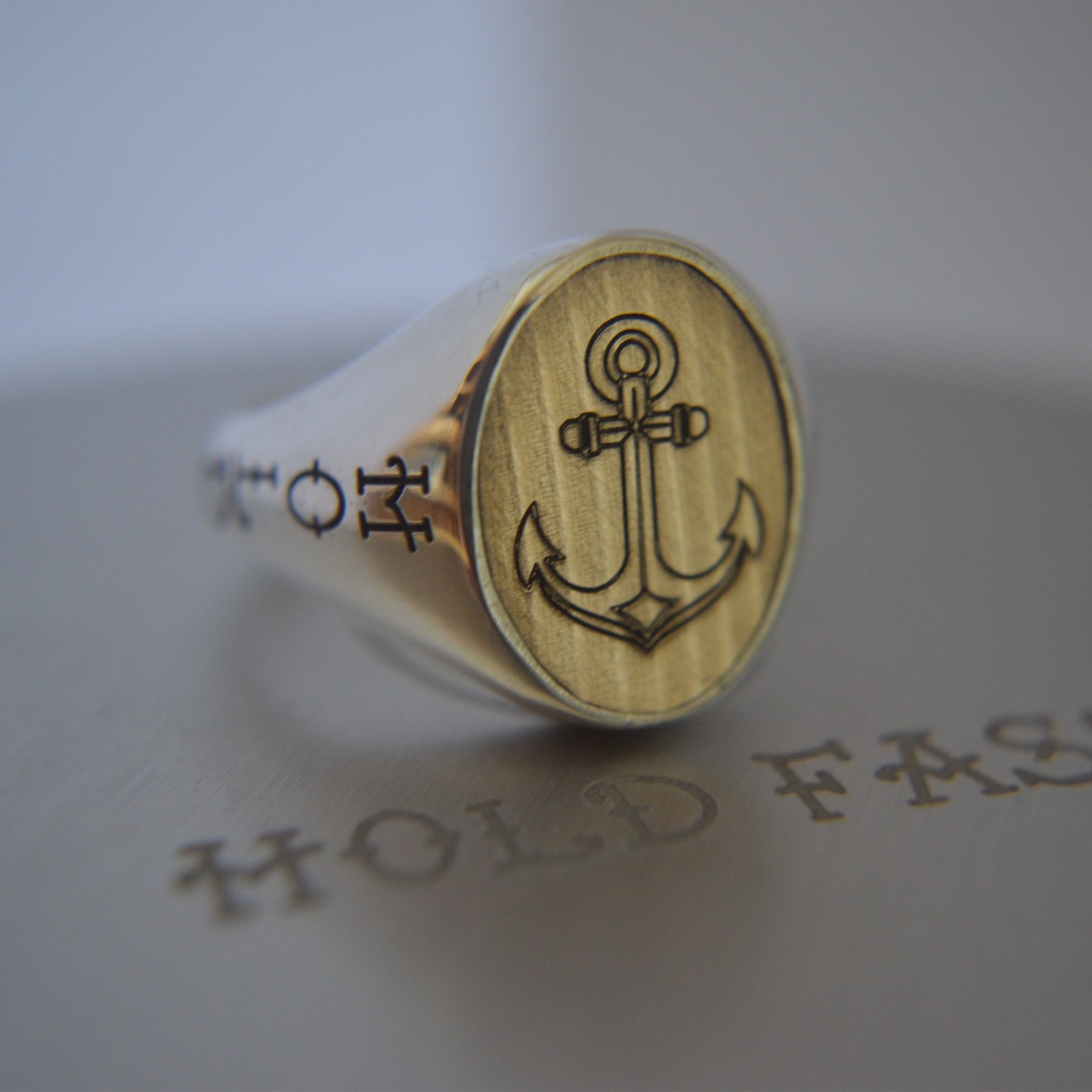 Silver ring with anchor design 